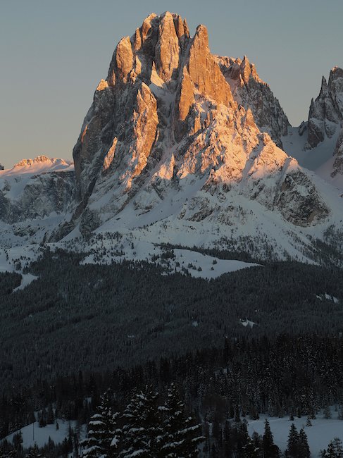 The Sassolungo at the sunset .