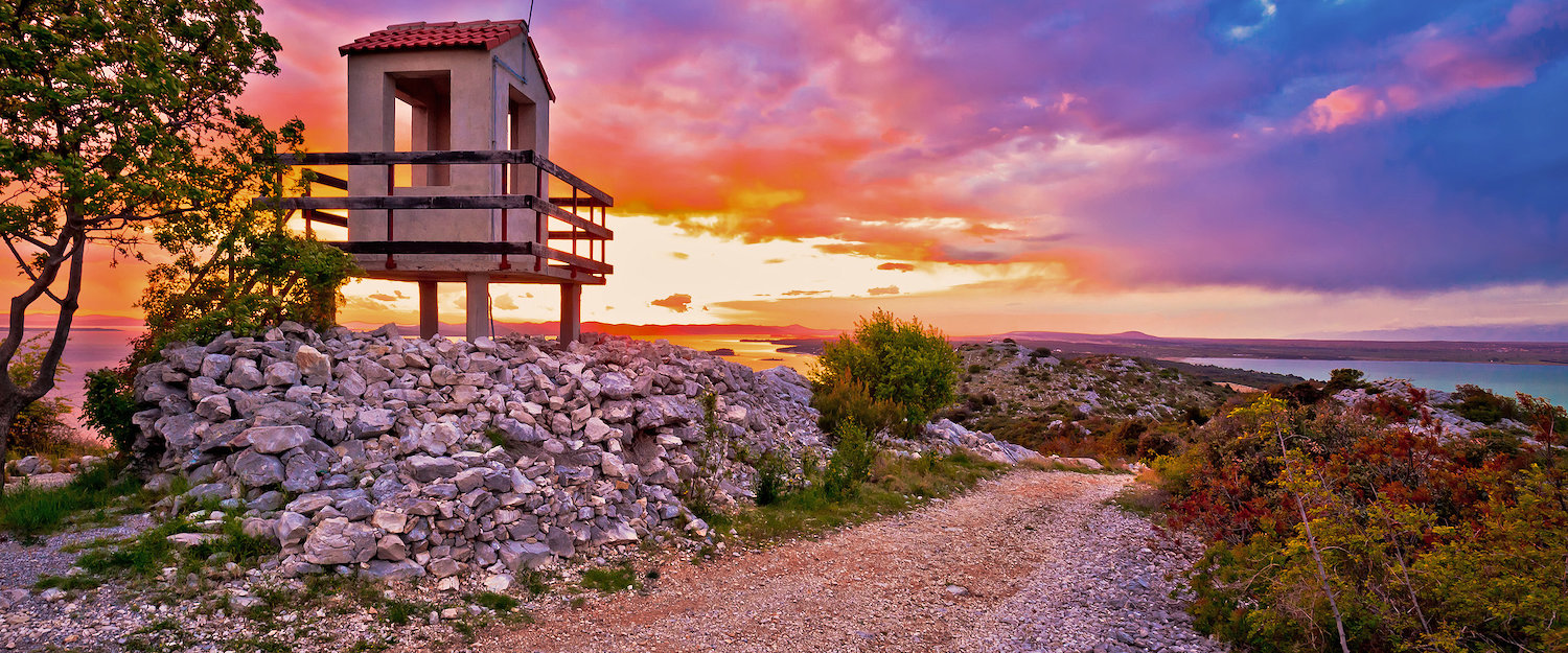 Lookout tower over Pakostane archipelago at sunset