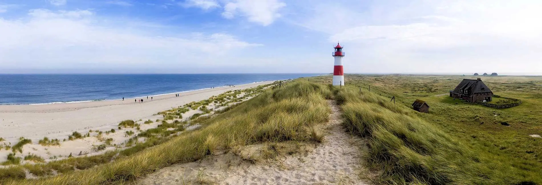 Lighthouse on a grassy beach