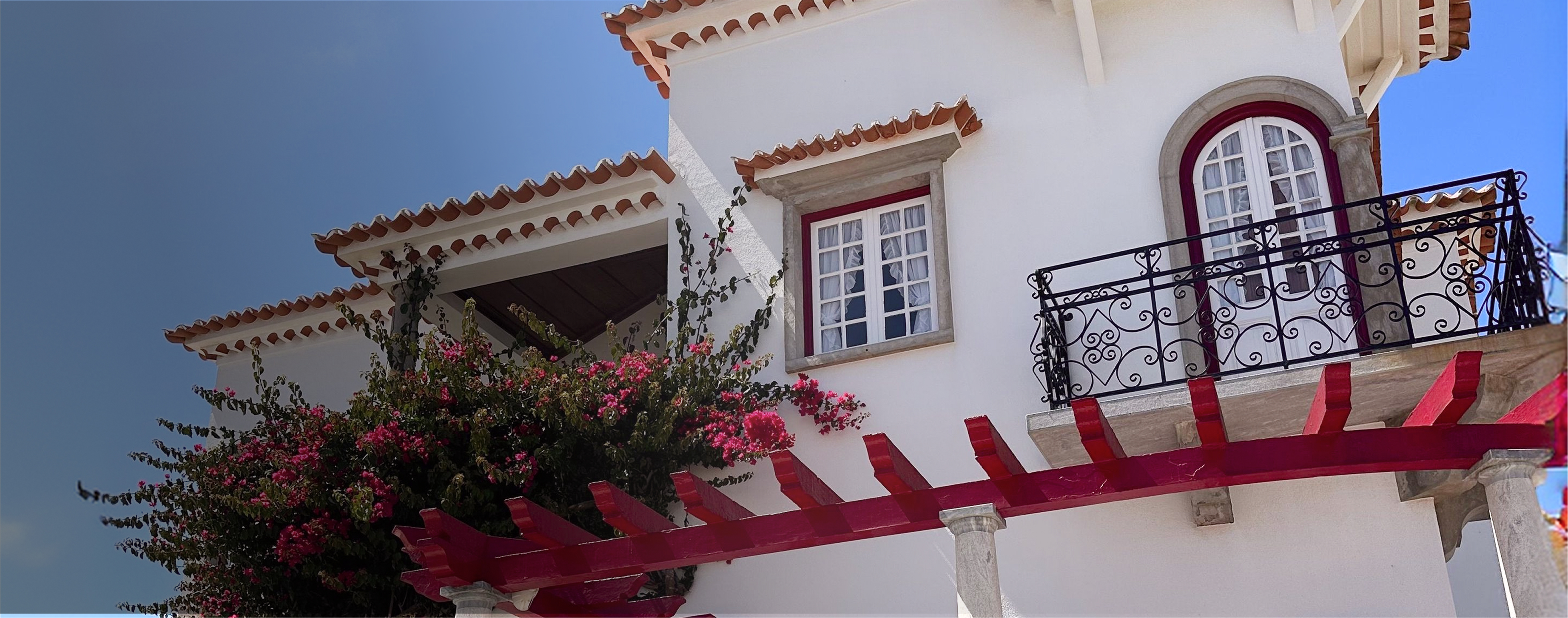 A beautiful house in Portugal with flowers and balcony