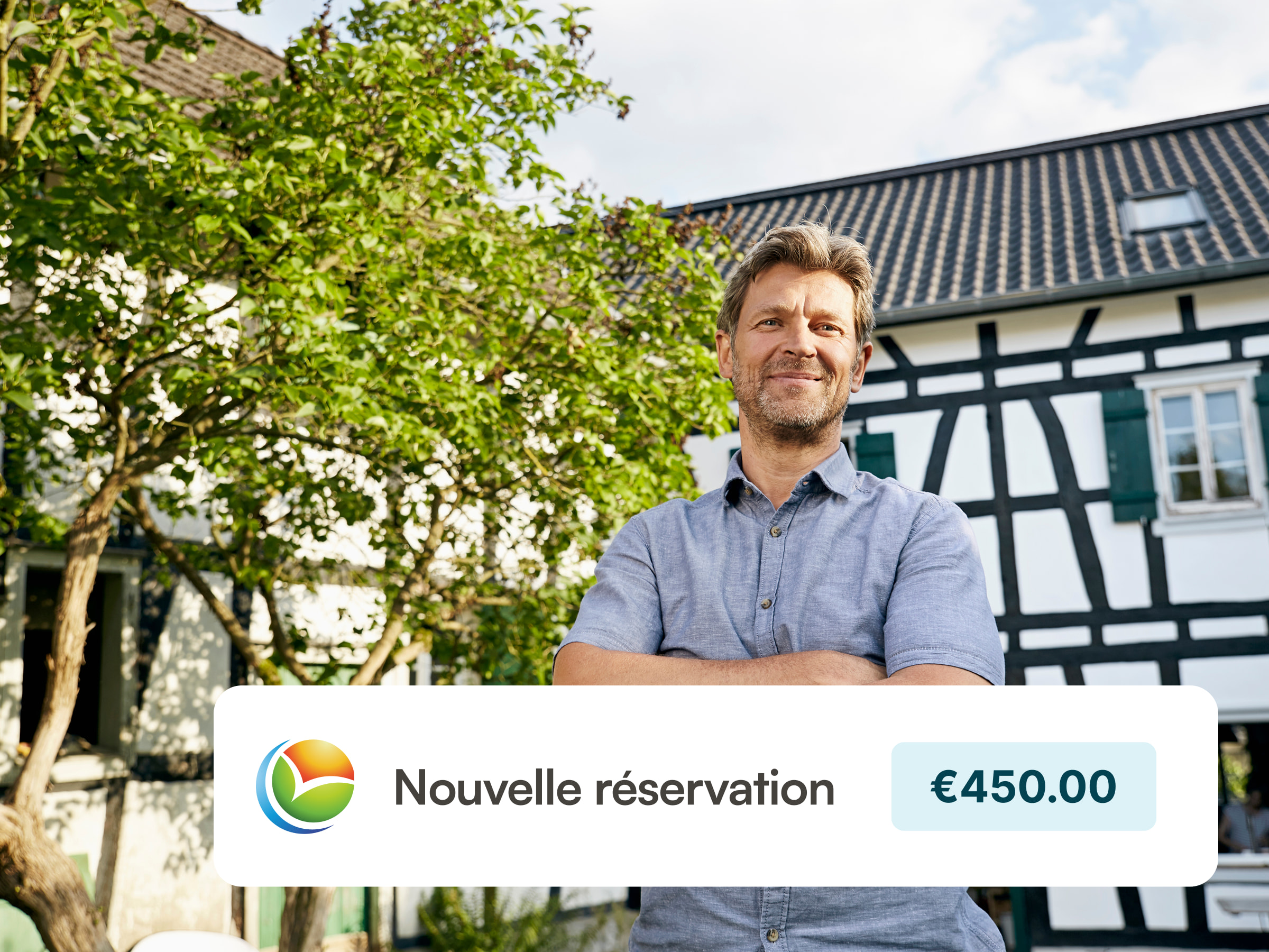 A smiling host standing in front of their B&B