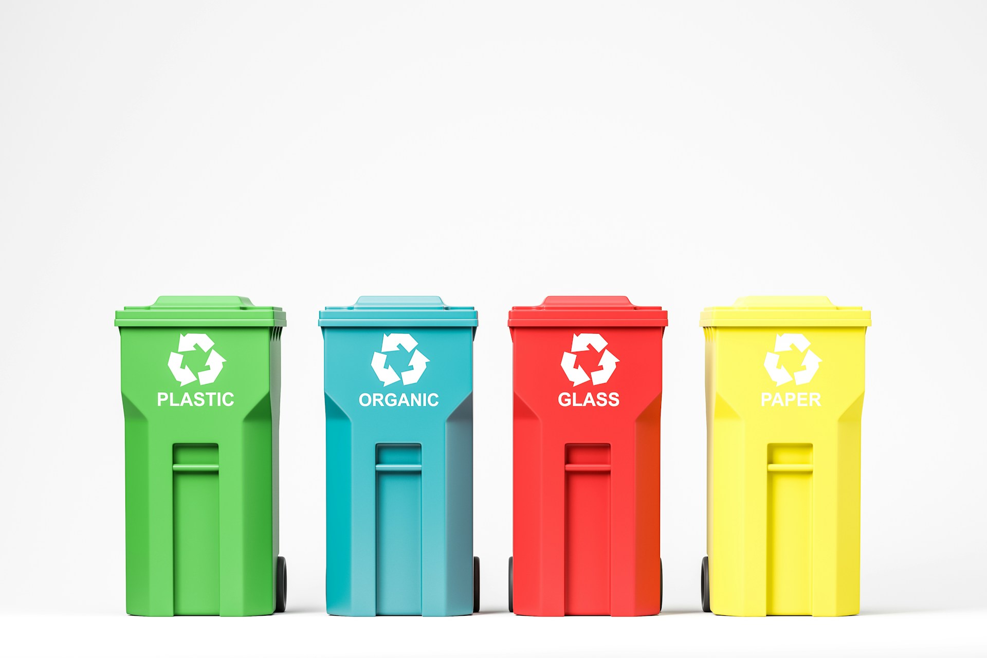 Four colour-coded recycling bins for plastic, organic, glass, and paper waste, each displaying a recycling symbol on a white background.