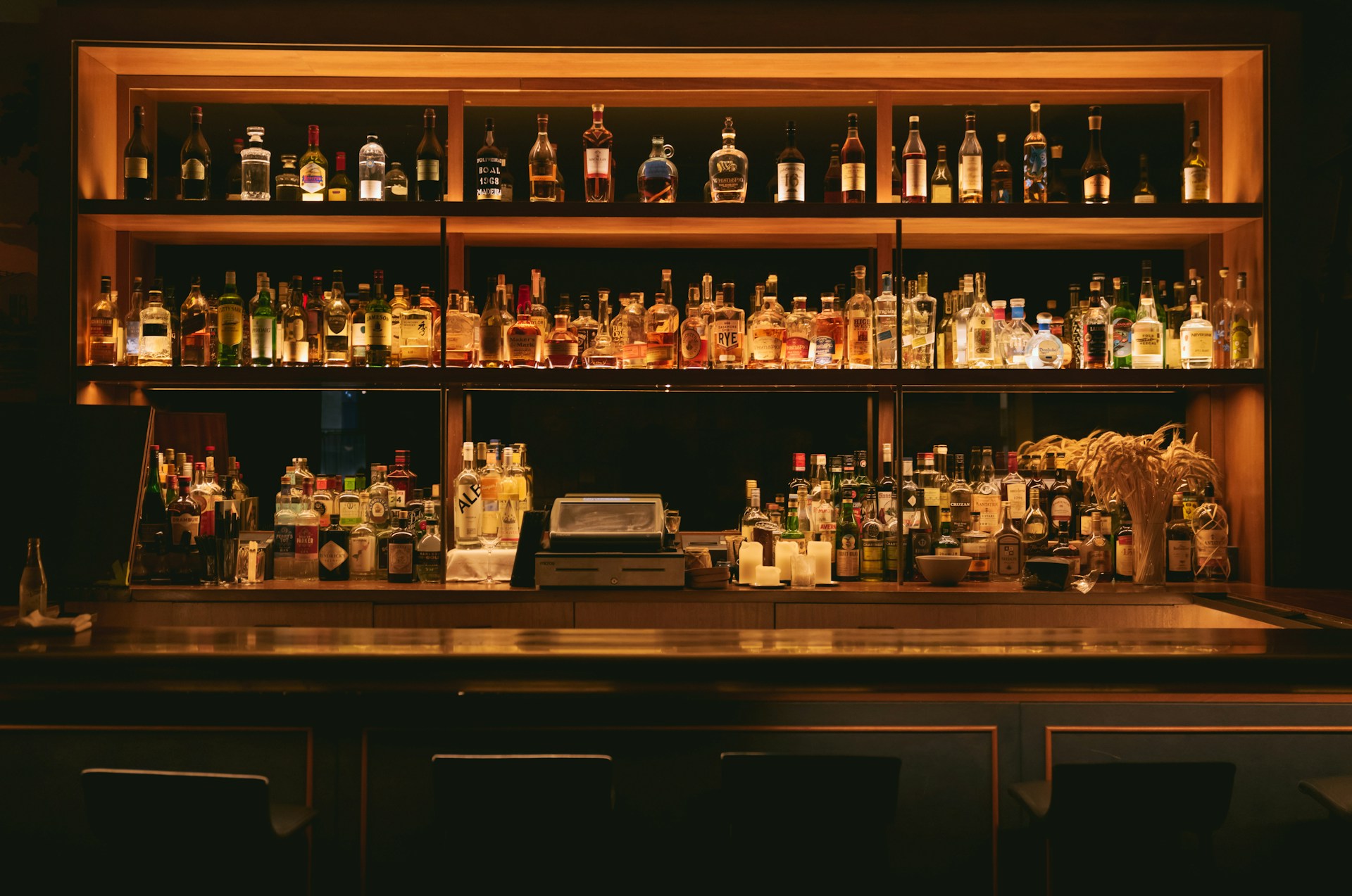 Edgar Chaparro Unsplash Bar filed with expensive alcohol drinks