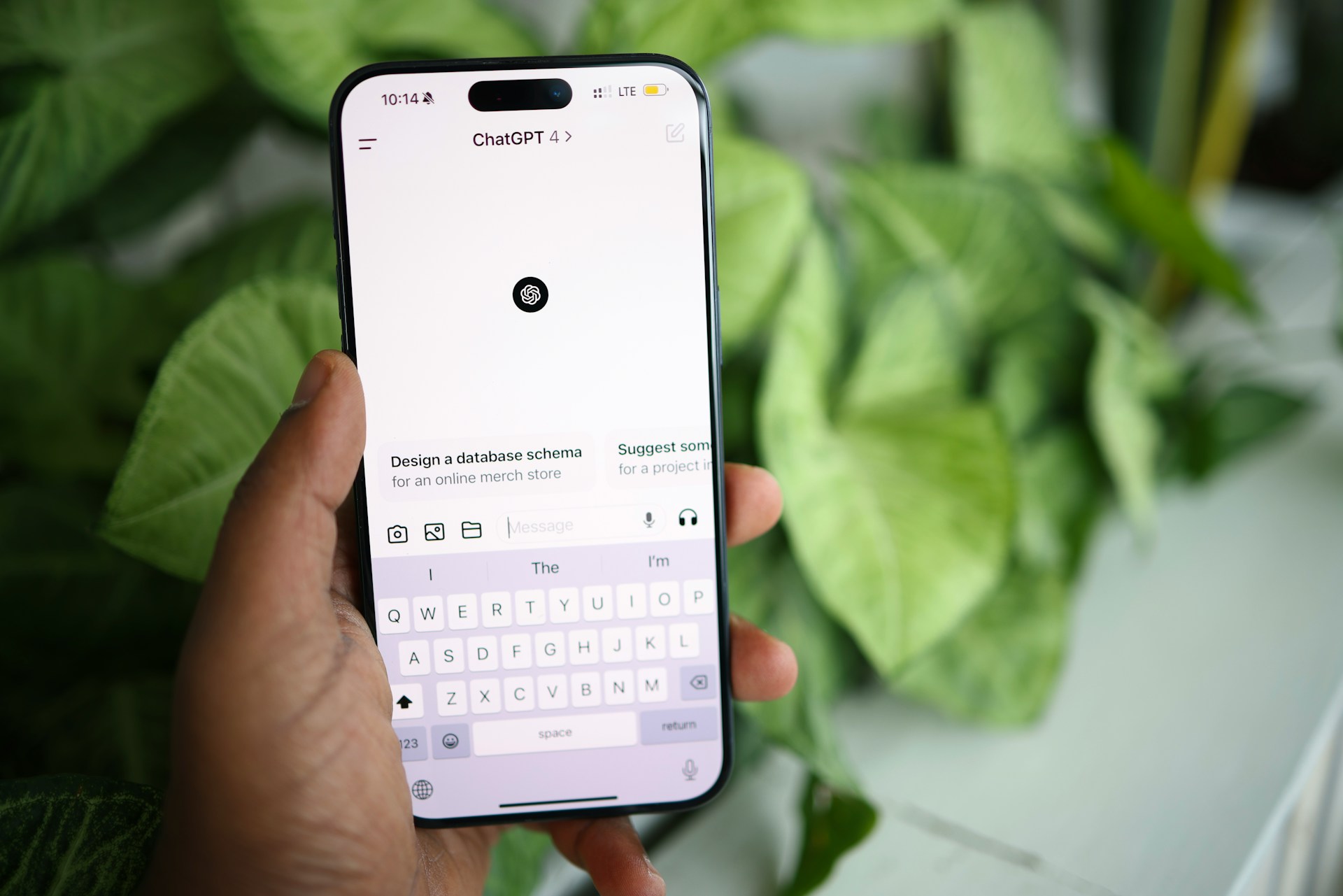 Person using ChatGPT on a smartphone to help write a holiday rental description