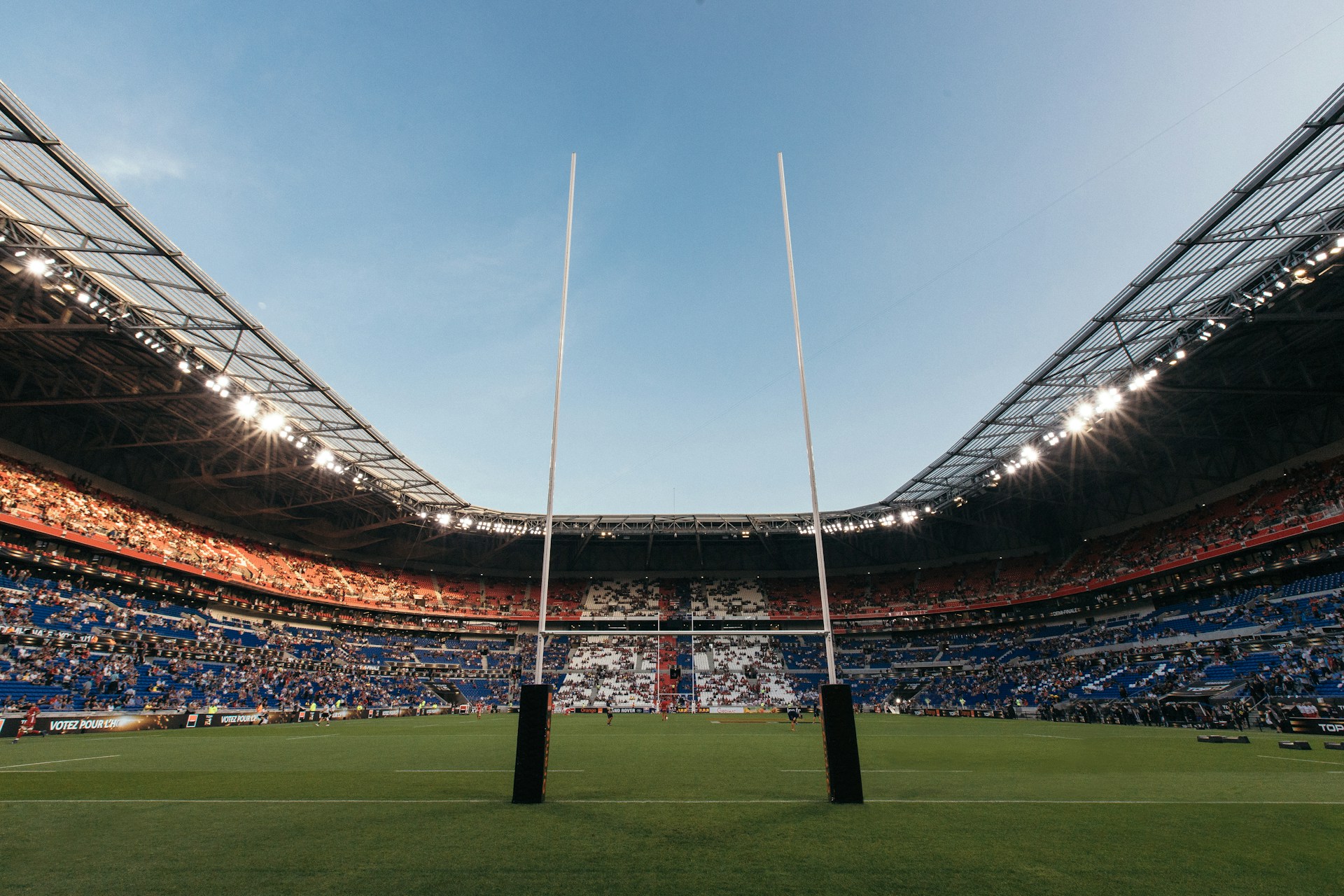 Rugby stadium with goalposts representing the Women's Rugby World Cup driving holiday rental bookings in England