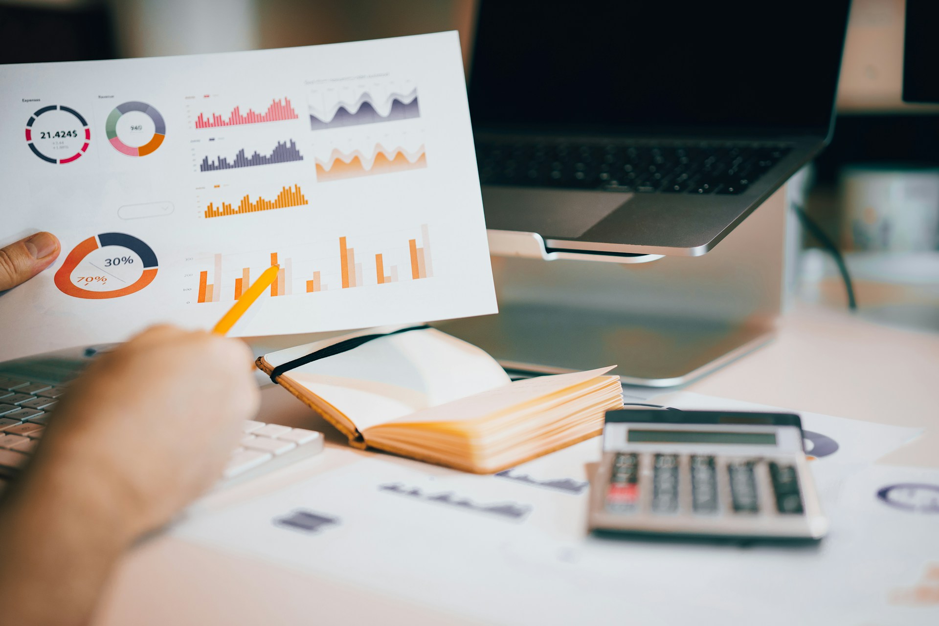 How to find your holiday rental’s break-even occupancy rate Person using charts to calculate the break-even occupancy rate of a holiday rental